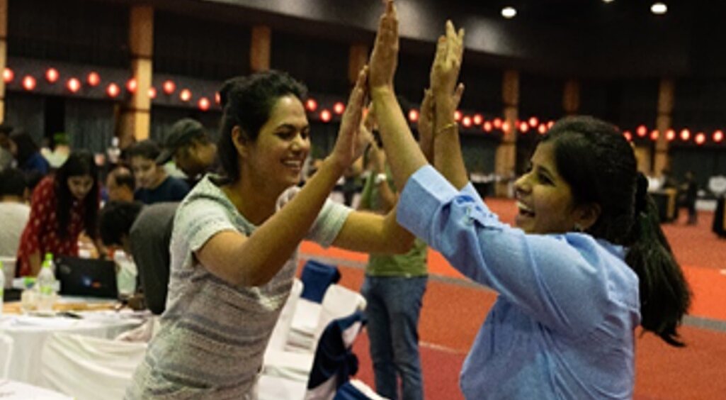 Participants celebrate completing a hands-on Logic Quest challenge