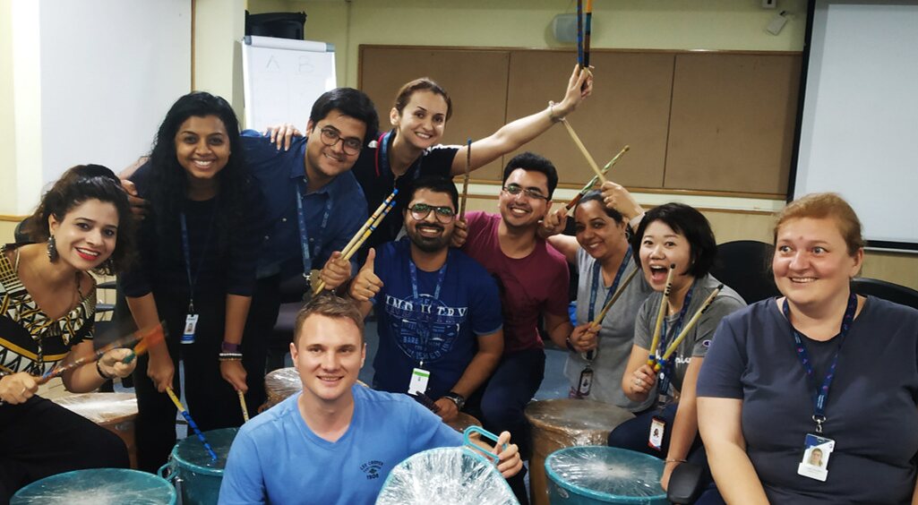 A group takes part in a TINKR rhythm and percussion workshop
